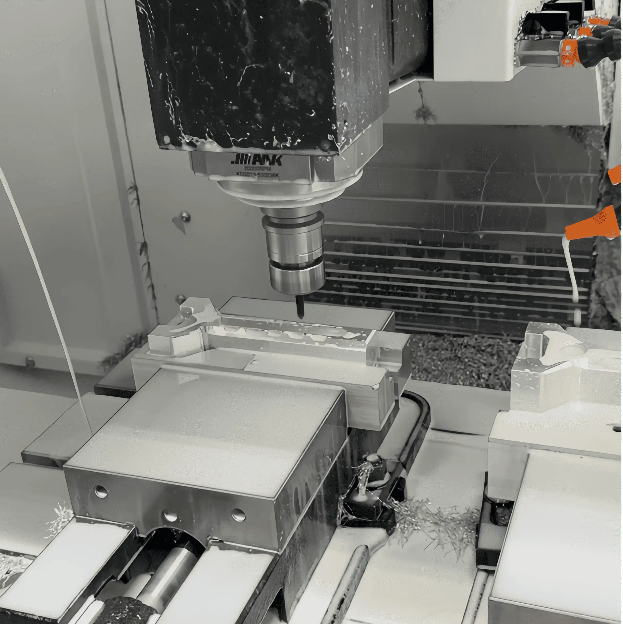 Close-up industrial view of an active CNC machining center milling the main body component of an AutoFling auto-loading slingshot from solid aerospace-grade 6061 aluminum.